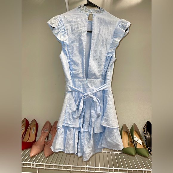 Saints + Secrets 
Size Small 
Baby blue ruffle romper 
100% cotton - Picture 2 of 4